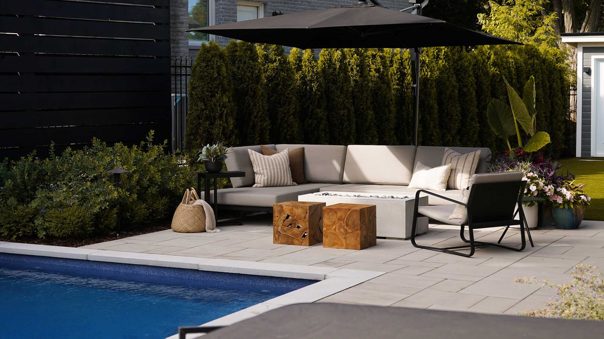 Modern Contempo chaise sectional and lounge chair by a pool
