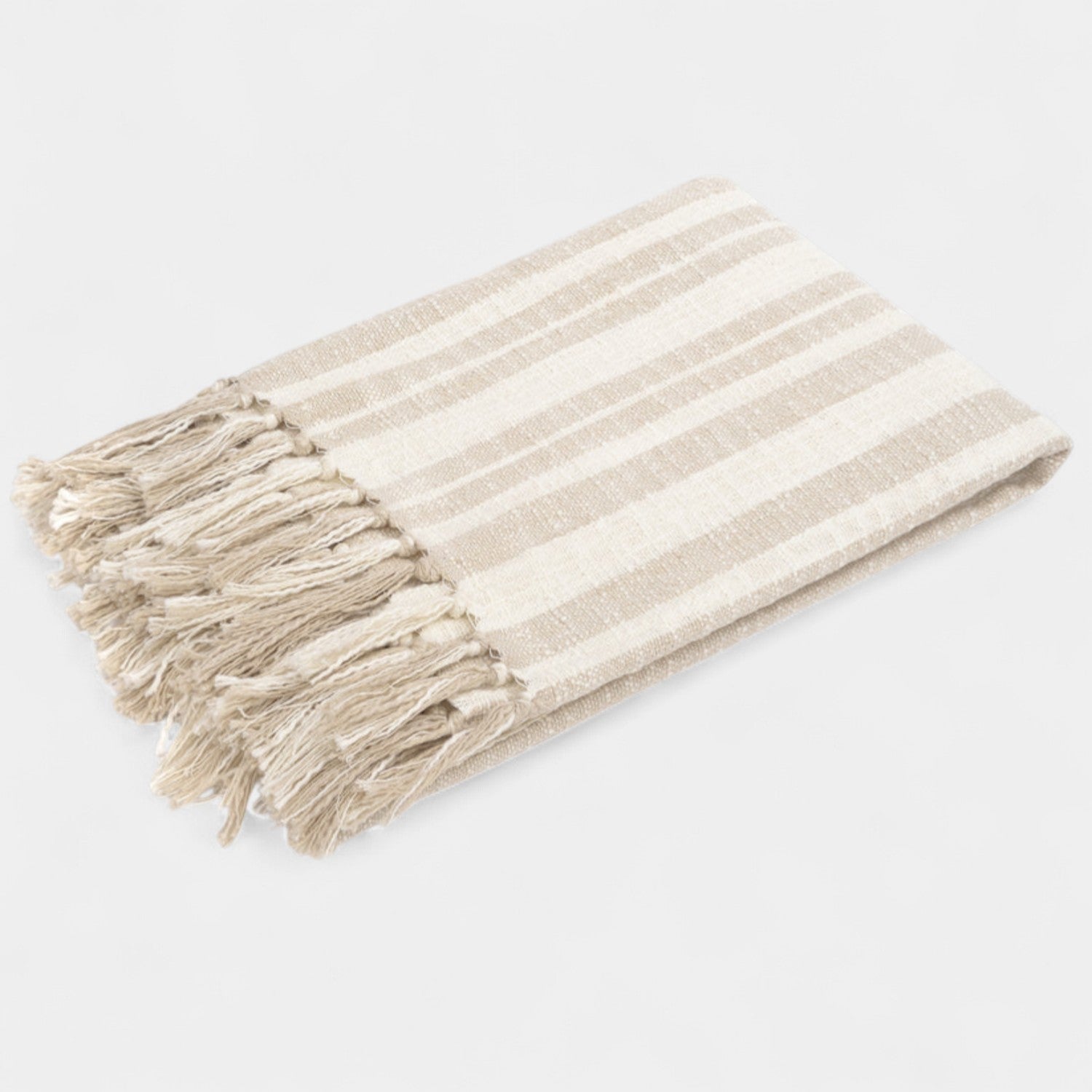 Beige and white striped towel with tassels on a light gray background