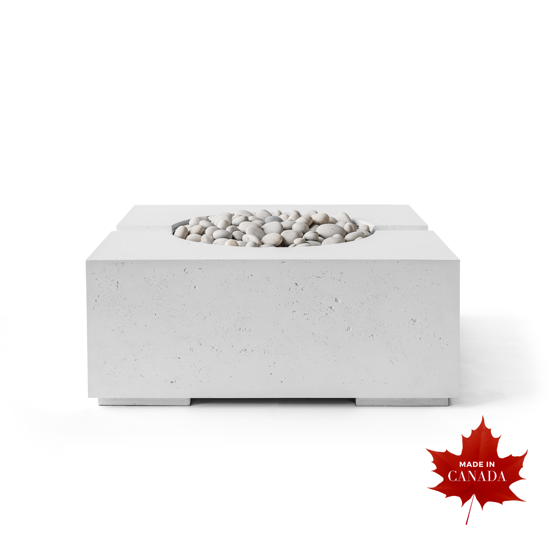 Premium contemporary outdoor Dekko concrete firepit, natural smooth honed Ash finish with raw concrete aesthetic, square cube shaped body, decorative smooth natural stones covering top centre of pit with flat ledge around stones