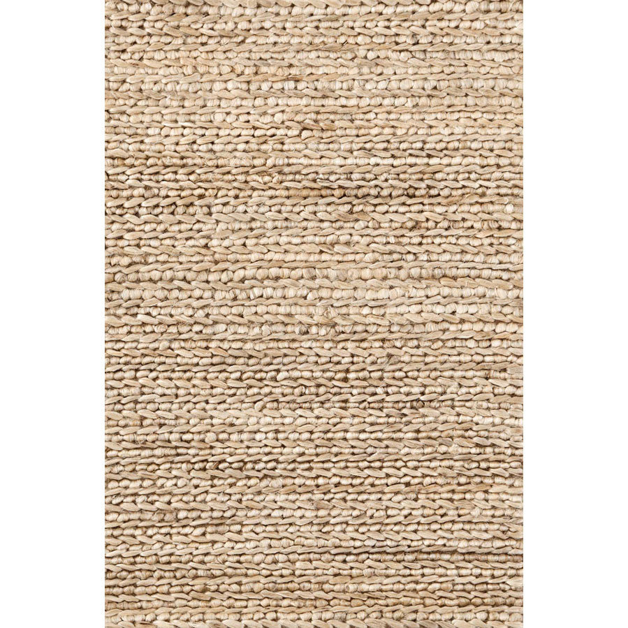 Premium indoor rug hand crafted in Jute and Cotton blend. A basket-like braided construction in natural sand colour. A high rug pile, with natural materials.
