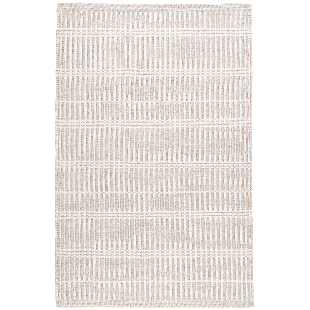 Premium indoor and outdoor rug, hand crafted in Polypropylene material. A tightly woven rug, the mini light taupe stripes are intersected by ivory stripes. A light weight, low rug pile that is washable.