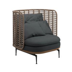 Premium outdoor aluminum based lounge chair, intricate high woven curved back, rounded teak seat base, three loose cushions for back, and deep double seat cushion in Sunbrella Cast Charcoal fabric