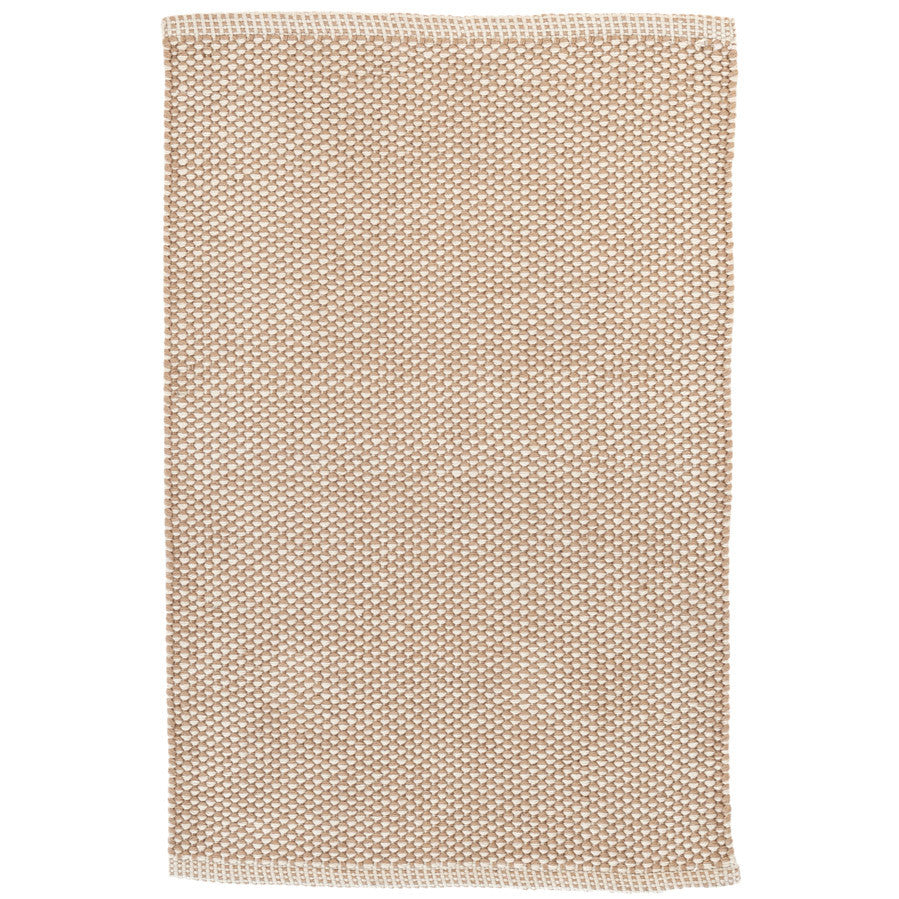 Premium indoor and outdoor rug, hand crafted with recycled plastic bottles. A pebble-like design with sand and cream colour blend. A reversible, low rug pile with soft wool-like texture. Washable and great for high-traffic areas.
