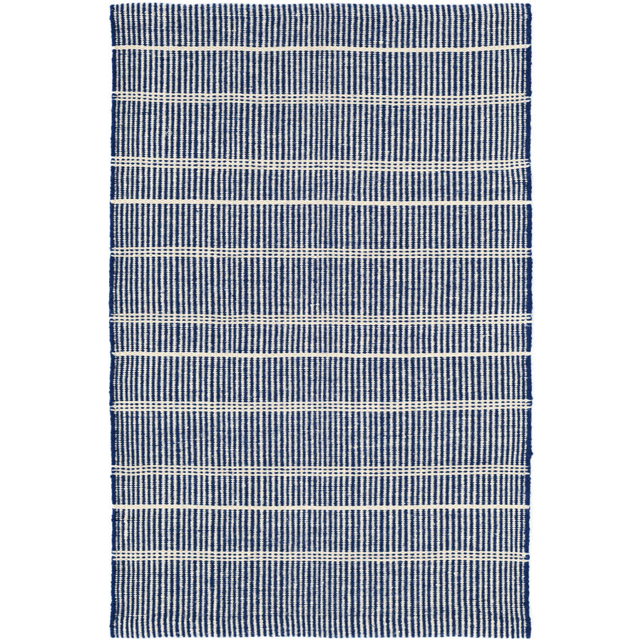 Premium indoor and outdoor rug, hand crafted in PET material. A mix of vertical navy stripes and horizonal cream stripes, that is reversible. Lightweight, low rug pile with soft texture.