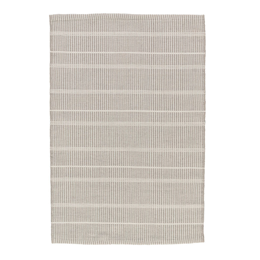 Premium indoor and outdoor rug, hand crafted in PET material. A mix of vertical grey stripes and horizonal cream stripes, that is reversible. Lightweight, low rug pile with soft texture. Washable.