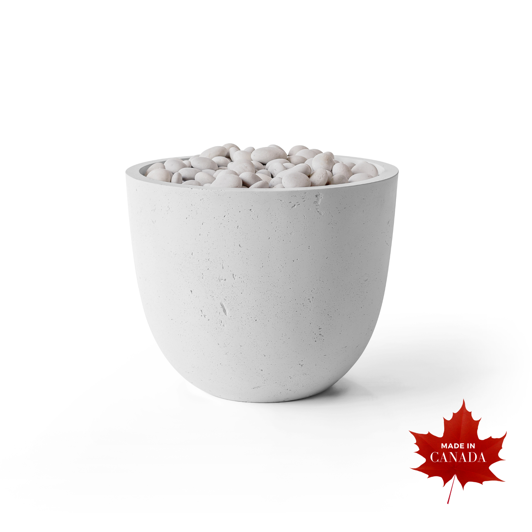 Premium contemporary outdoor Dekko concrete firepit, natural smooth honed Ash finish with raw concrete aesthetic, barrelled walls and cupped shaped body, decorative smooth natural stones covering top of pit