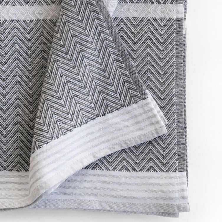 Premium one of kind cotton beach/bath towel, intricate chevron pattern in warm grey and white with white band at edge and white stripes