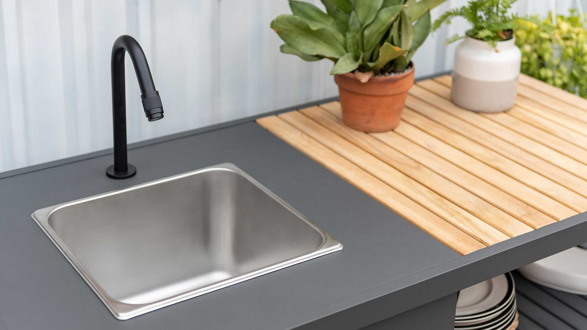 charcoal aluminum and teak modern outdoor kitchen counter with stainless steel sink