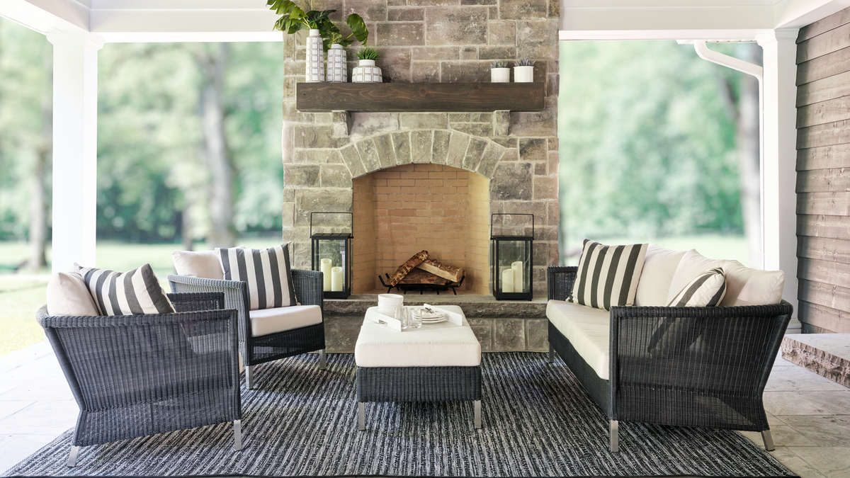 Haven sofa accent table and chairs by outdoor fireplace