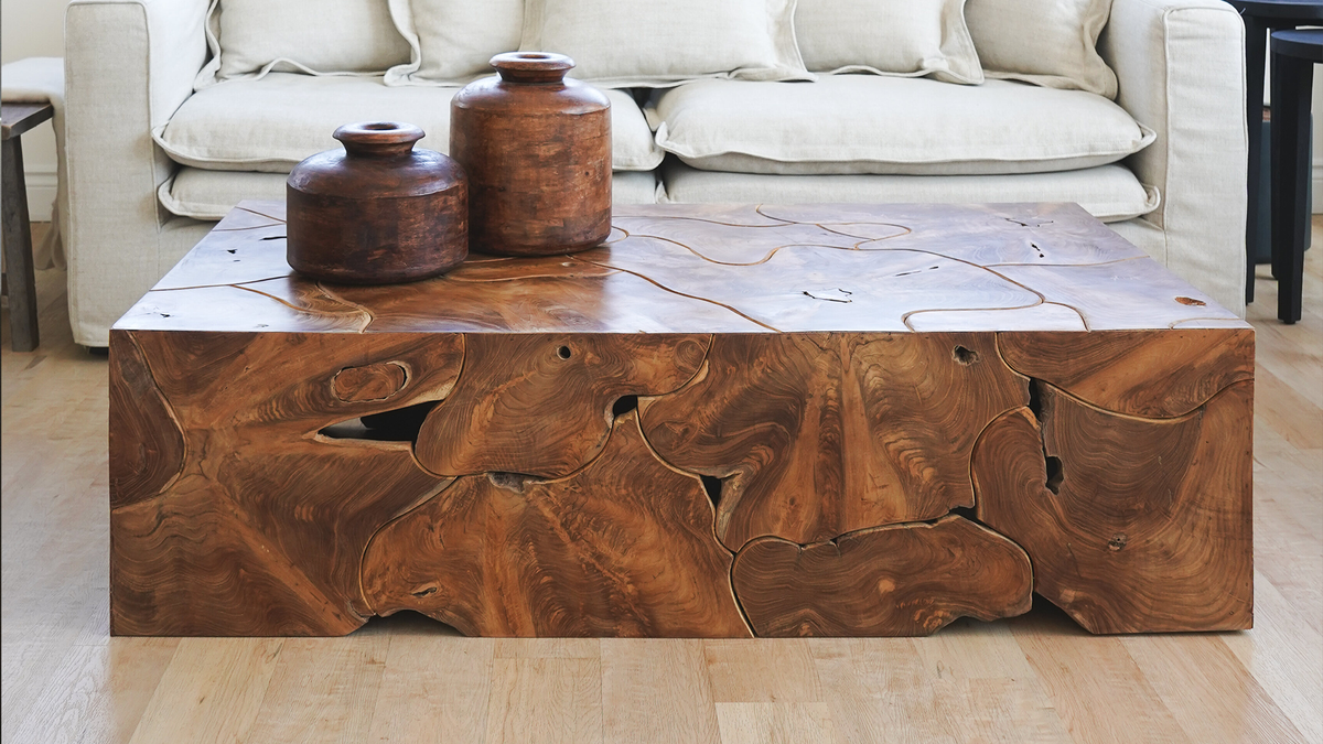 Rectangular teak root coffee table made from pieces of teak root.