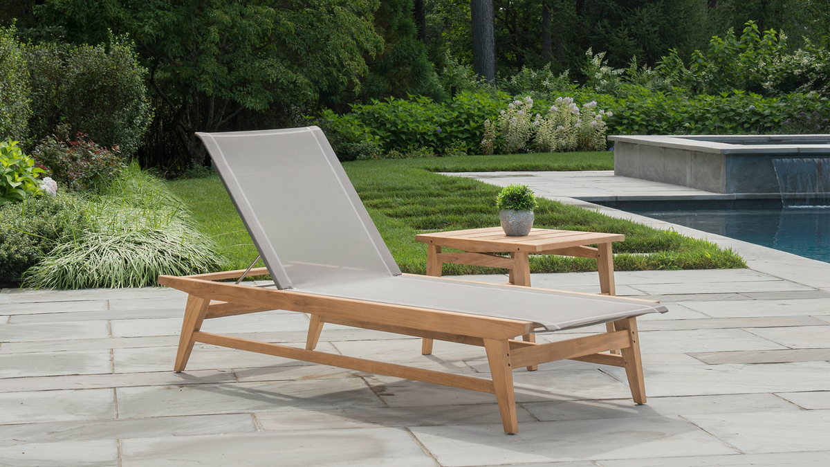 Marin collection chaise lounge and accent table on poolside patio
