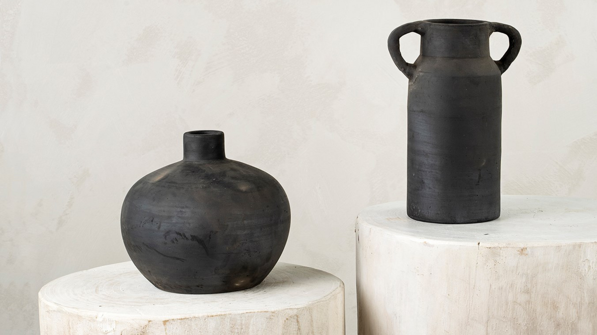 Black ceramic rustic vase vessel.