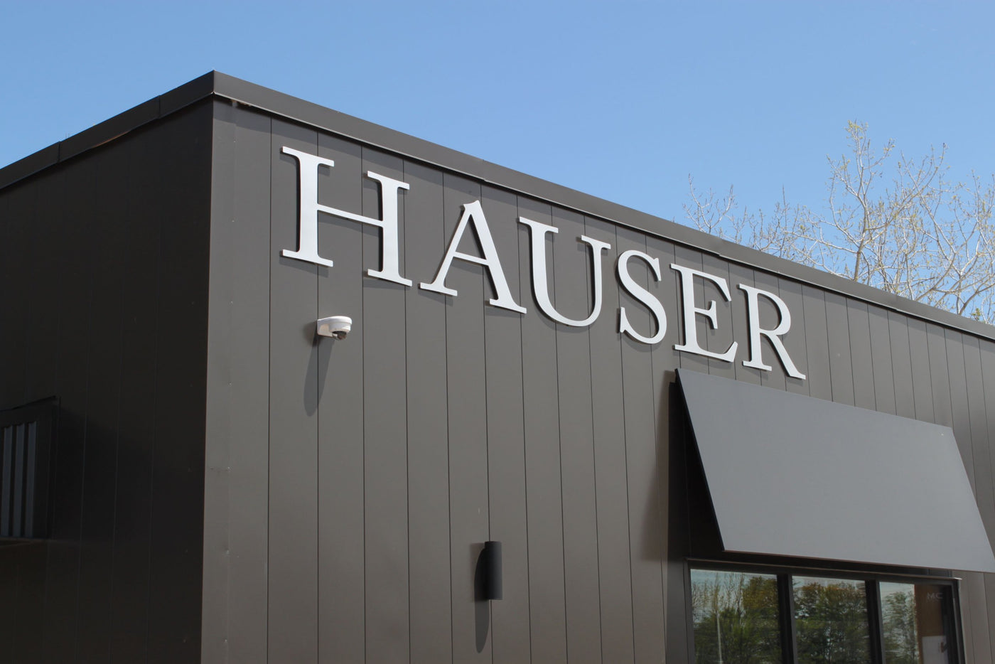 Outside of Hauser Storefront showing Hauser sign
