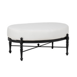 traditional outdoor cast aluminum ottoman, oval shape, black frame, claw foot inspired feet, four legged ottoman frame, intricate shapes and detailing that give a touch of french bistro