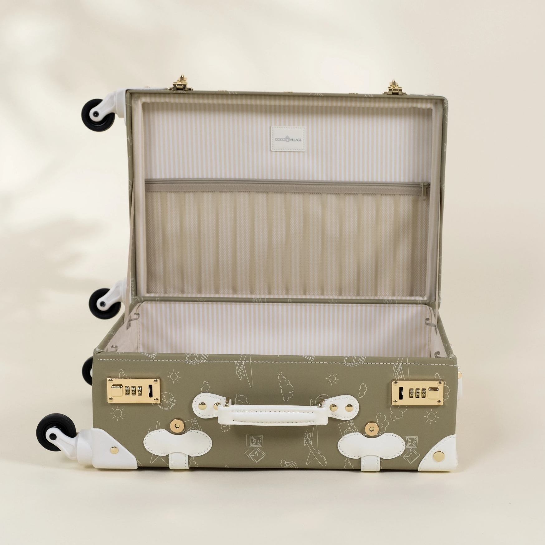 Open suitcase with decorative patterns on a light background