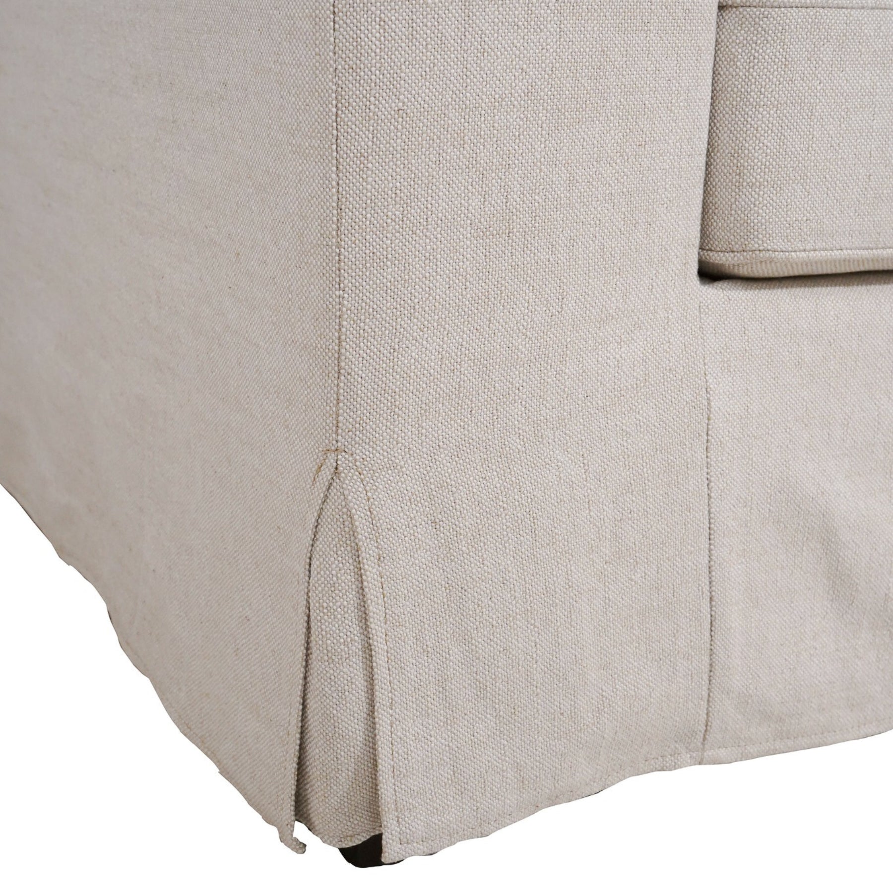 Close-up of a beige fabric surface with a subtle pattern