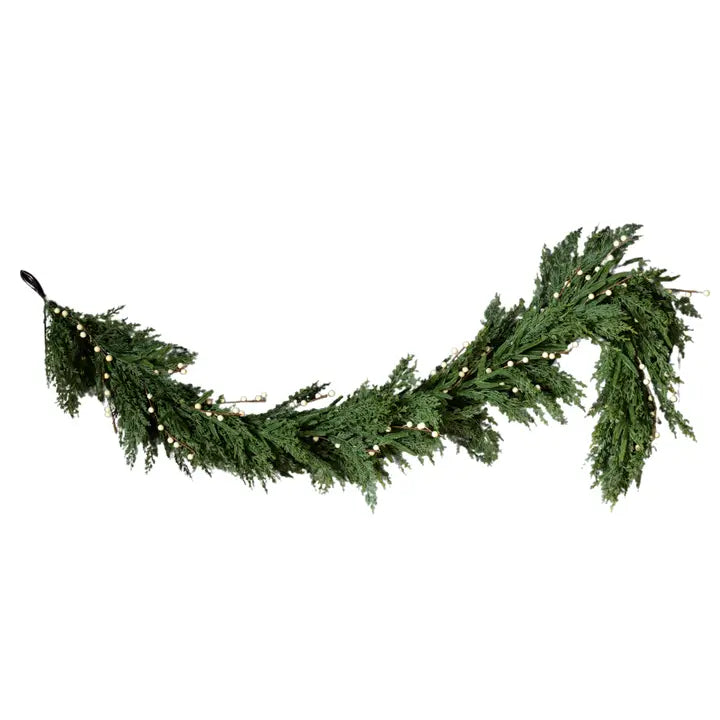 Green artificial Christmas garland on a white background