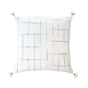 Square linen/cotton blend pillow, white with blue cross hatch pattern, white tassels at corners, coastal feel