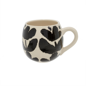 Cream stoneware mug with modern black floral print, round shape