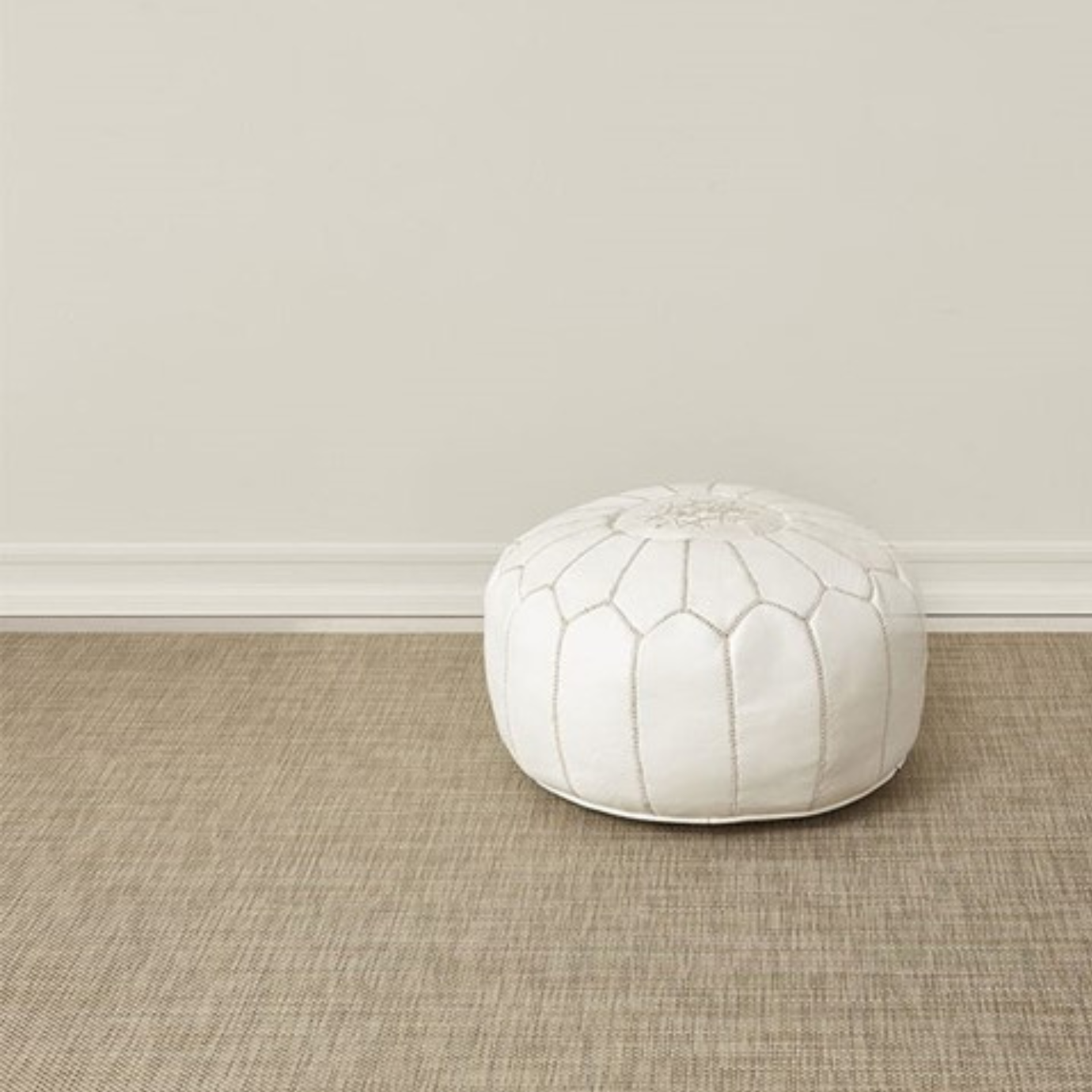 Premium indoor and outdoor rug, made from terrastrand yarns with a slip-resistant latex backing. A heathered rug blends shades of coffee brown and dark brown with speckles of white, in a weave design.