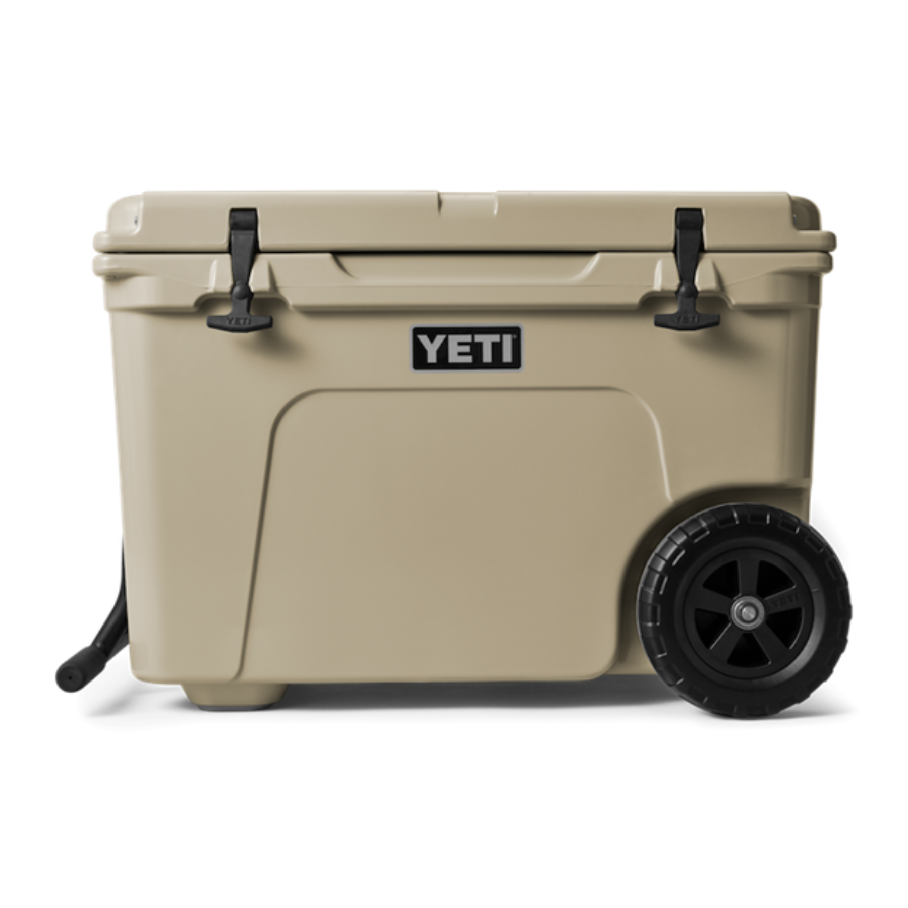 Yeti Tundra Haul, hard shelled cooler, tan colour, two wheels on one end, arm for hauling on opposite end, hinge lid