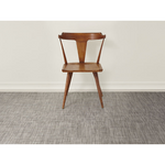 Premium indoor and outdoor rug, made from terrastrand yarns with a slip-resistant latex backing. A heathered rug blends shades of light brown, dark brown with speckles of white, in a weave design.