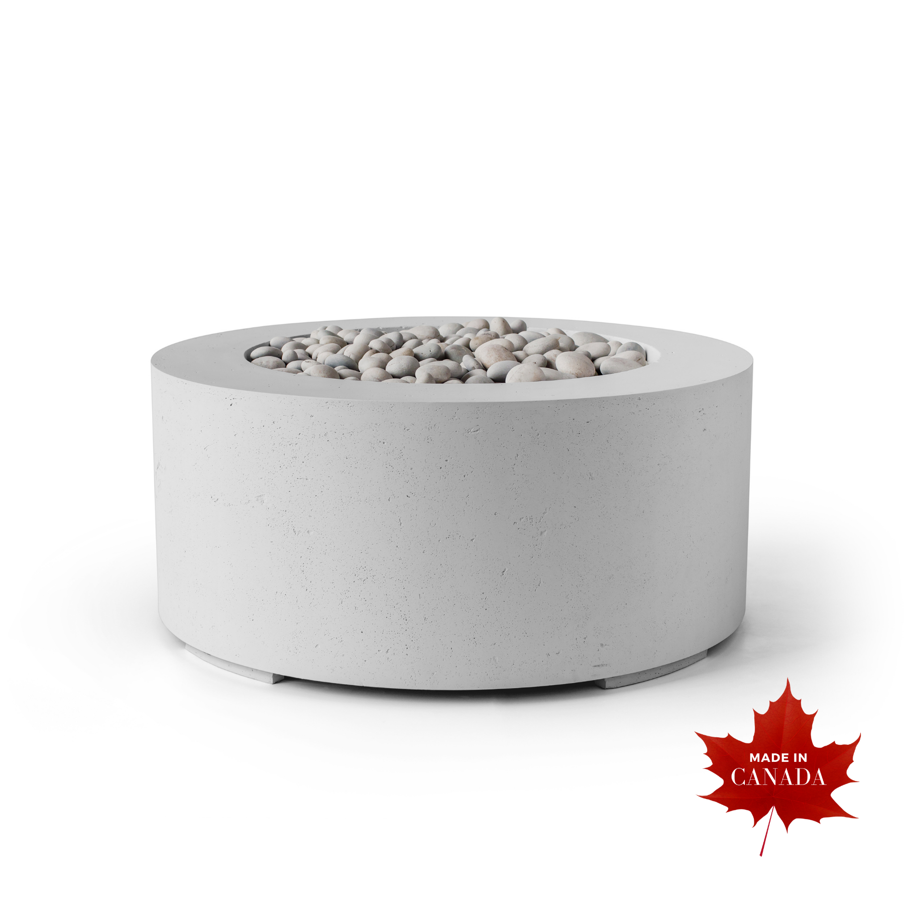 Premium contemporary outdoor Dekko concrete firepit, natural smooth honed Ash finish with raw concrete aesthetic, cylindrical shaped body, decorative smooth natural stones covering top centre of pit with flat ledge around stones