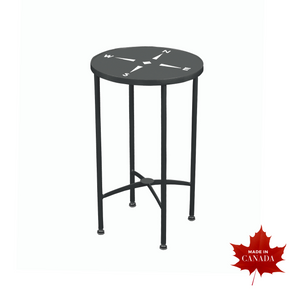 Transitional indoor/outdoor side table in black aluminum, compass cutout on round table top, four tubular sleek legs
