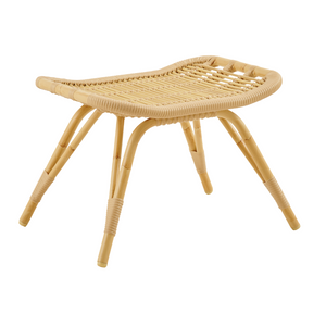 Premium indoor foot stool in natural rattan.  Four widespread rattan legs, delicately wrapped with rattan at the base of each foot. The saddle shaped seat is intricately woven in criss-crossed rows.  