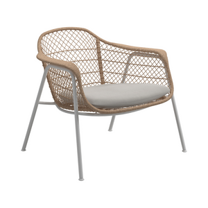 Modern  outdoor sun lounge chair with white aluminum frame, wheat coloured all-weather wicker weave, and Sunbrella Blend linen cushion.