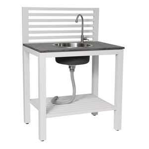 Transitional outdoor premium white kitchen counter with sink, slatted open lines of aluminum behind backsplash, round stainless steel sink, simple tall stainless faucet, light grey granite counter top, open slatted shelf below sink