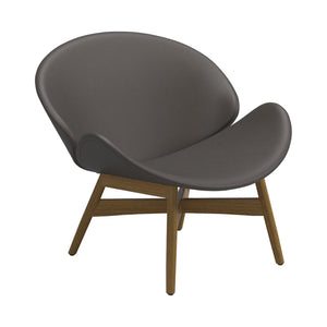 Indoor/Outdoor modern, Danish inspired lounge chair, faux leather in grey, rounded seat and back, teak legs