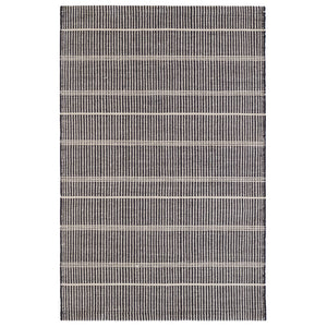 Premium indoor and outdoor rug, hand crafted in PET material. A mix of vertical black stripes and horizonal cream stripes, that is reversible.  Lightweight, low rug pile with soft texture. 
