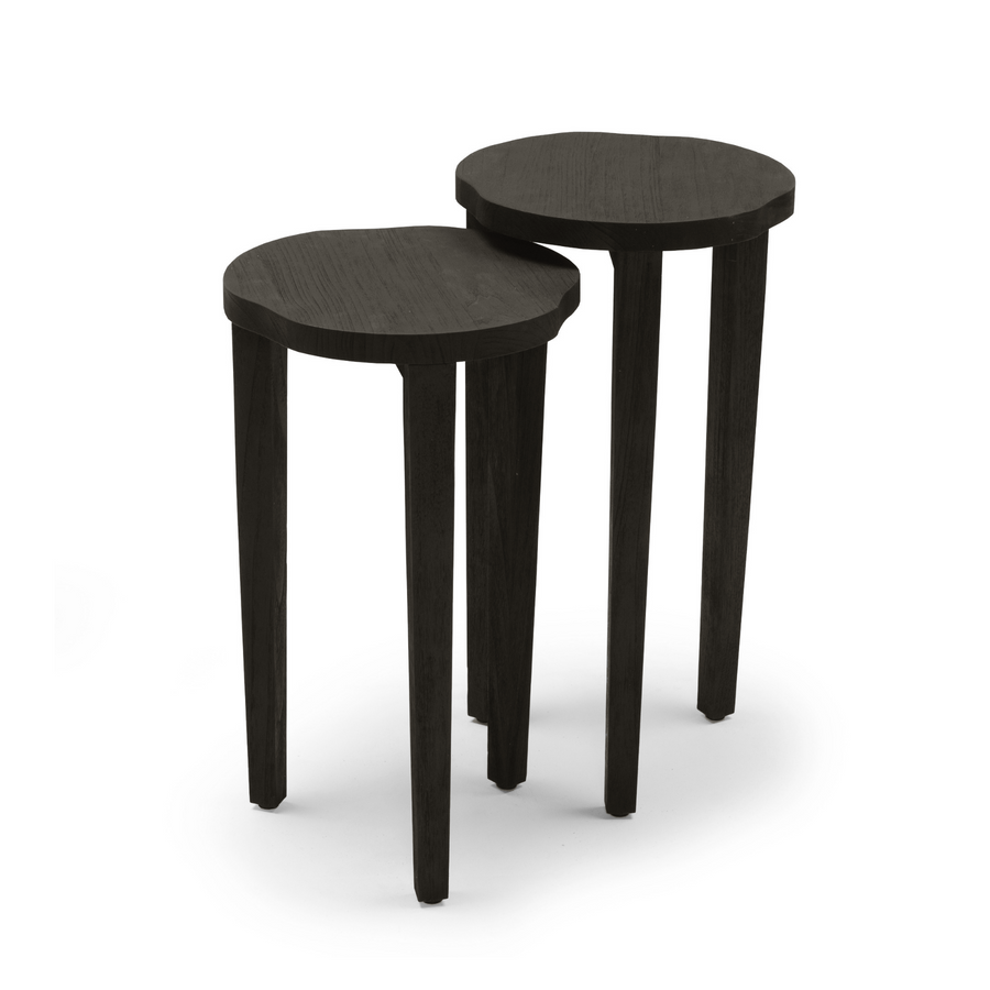 Premium indoor teak nesting tables , crafted in a contemporary black finish, can be paired together or on their own, smaller table tucks under large on, three legs, round curvy top